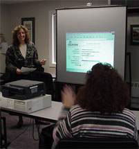Darlene McCormick of Mad River Consulting leads training session on website hosting to salespeople of Waitsfield Telecom